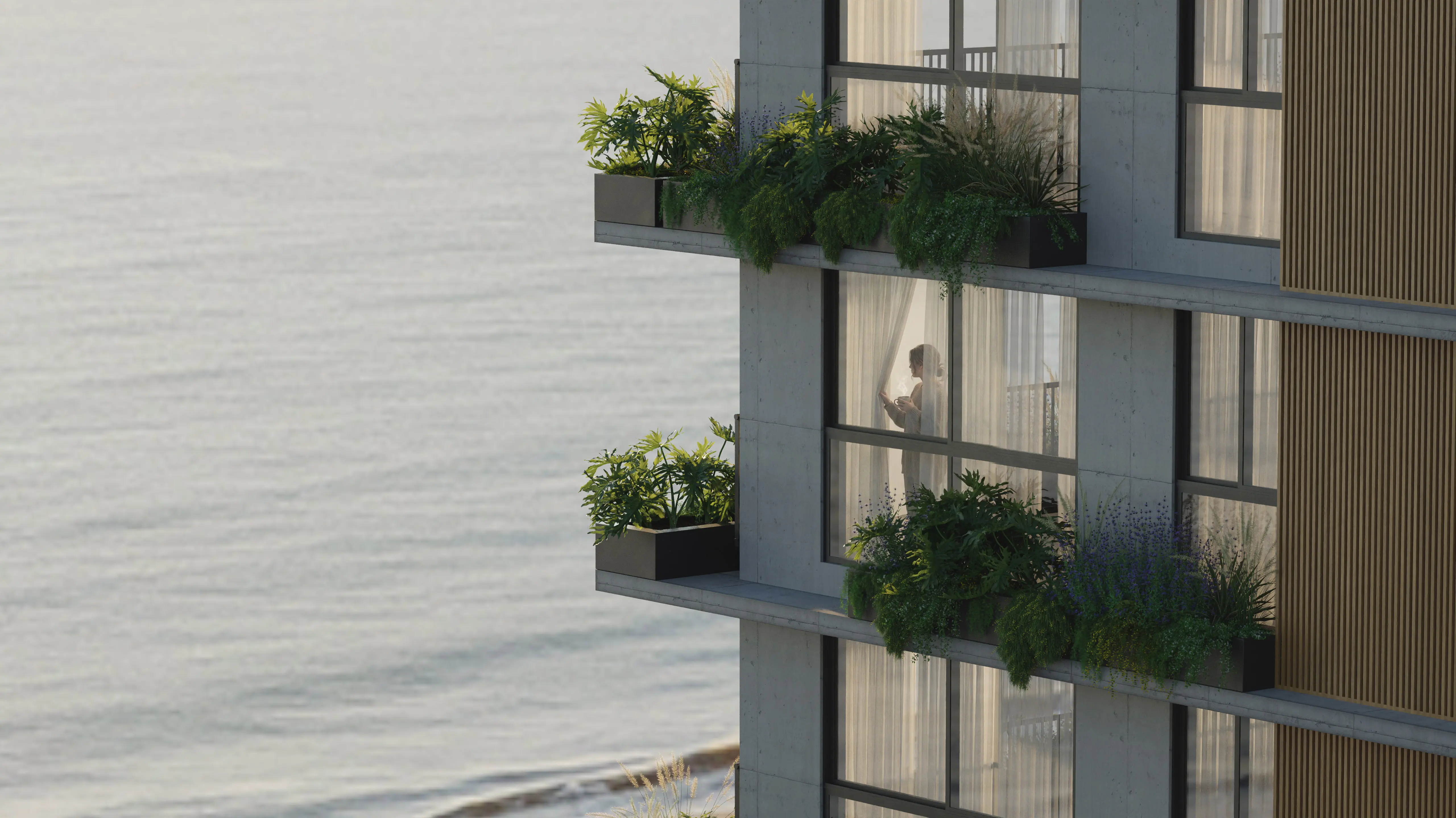 Detalhe das varandas do Nuar Residence com jardins exuberantes, brises em madeira e vista lateral para o mar, com morador visível através das esquadrias de vidro