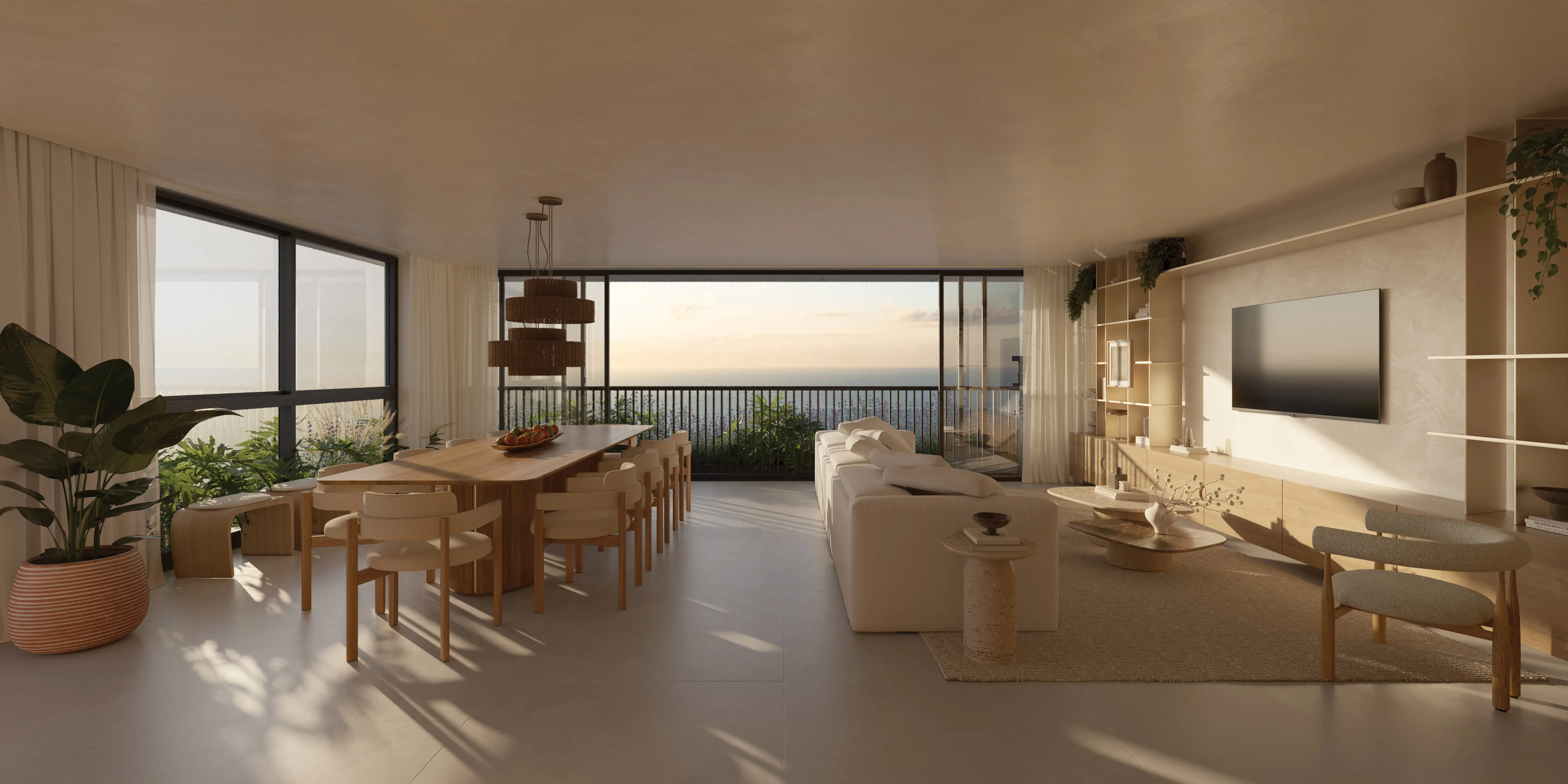 Sala de estar e jantar integradas de apartamento do Nuar Residence em Balneário Piçarras, com mesa em madeira, sofá, estante com TV, plantas, amplas janelas com varanda e vista para o mar ao entardecer